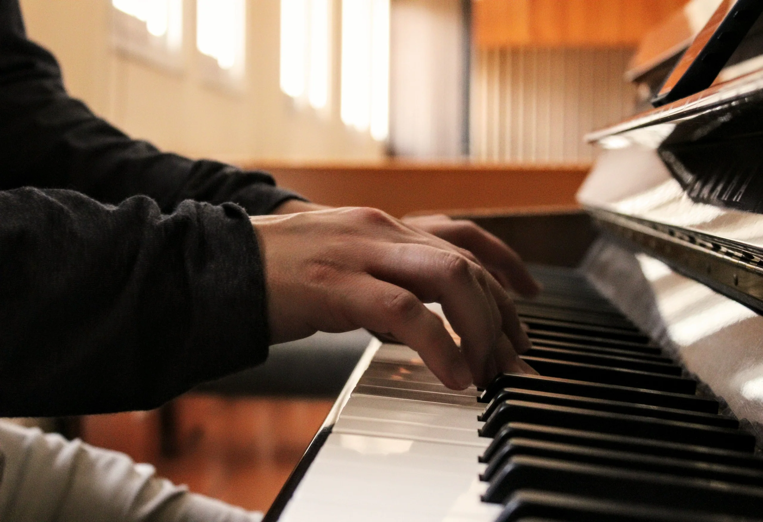 A pianist's hands at the keys during practice