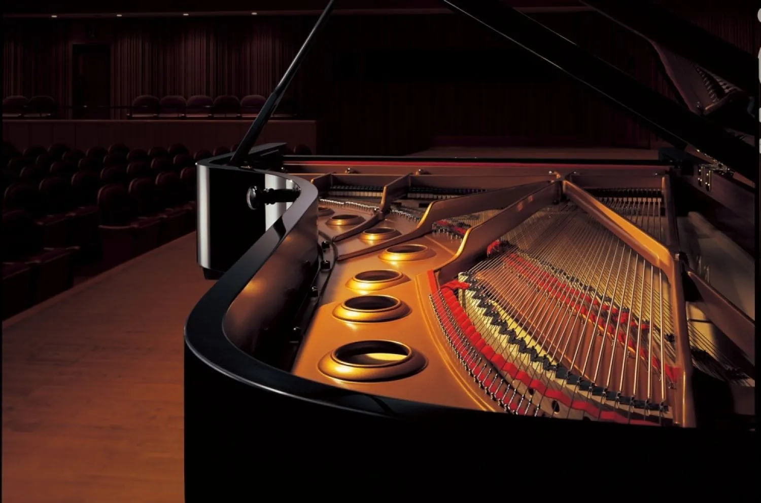 A Yamaha grand piano on a recital stage